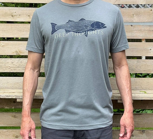 Man wearing heather blue-grey t-shirt with navy blue striped bass illustration and faded DEEP THOUGHTS text
