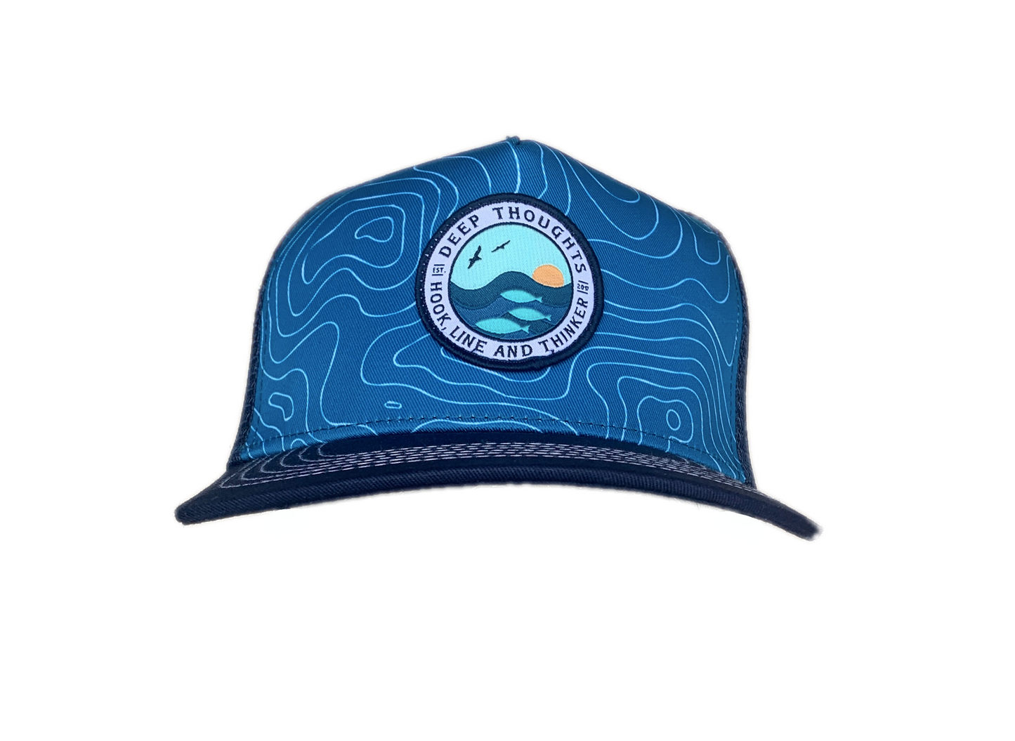 front view of aquamarine and navy blue trucker hat with round patch depicting ocean swells with fish beneath the waves