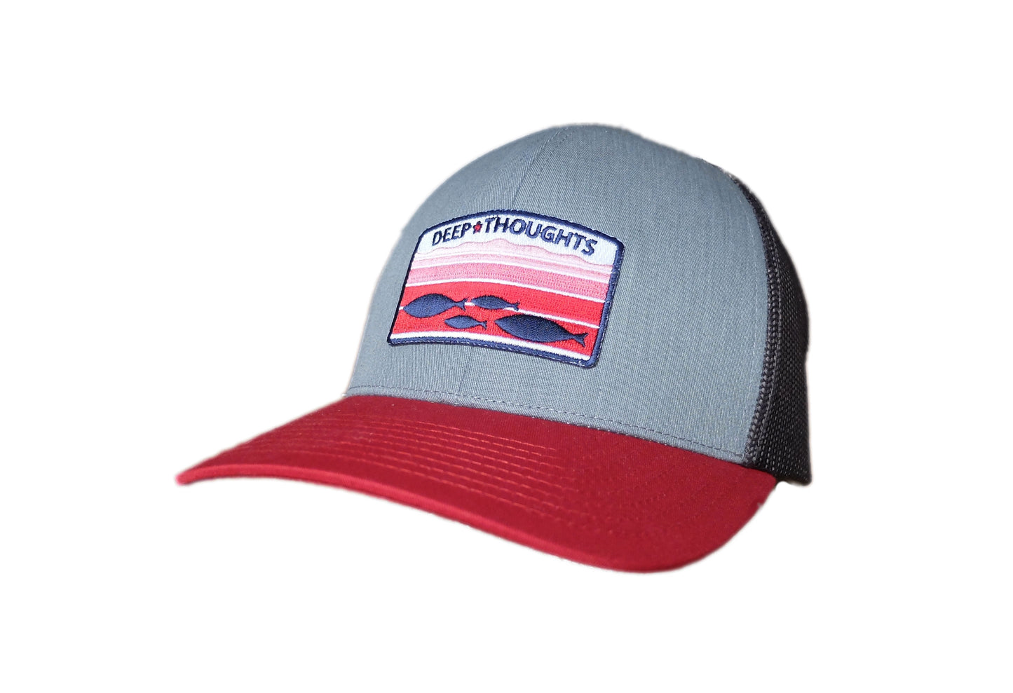 grey red and charcoal structured trucker cap with embroidered red white and blue patch showing fish swimming under ocean currents