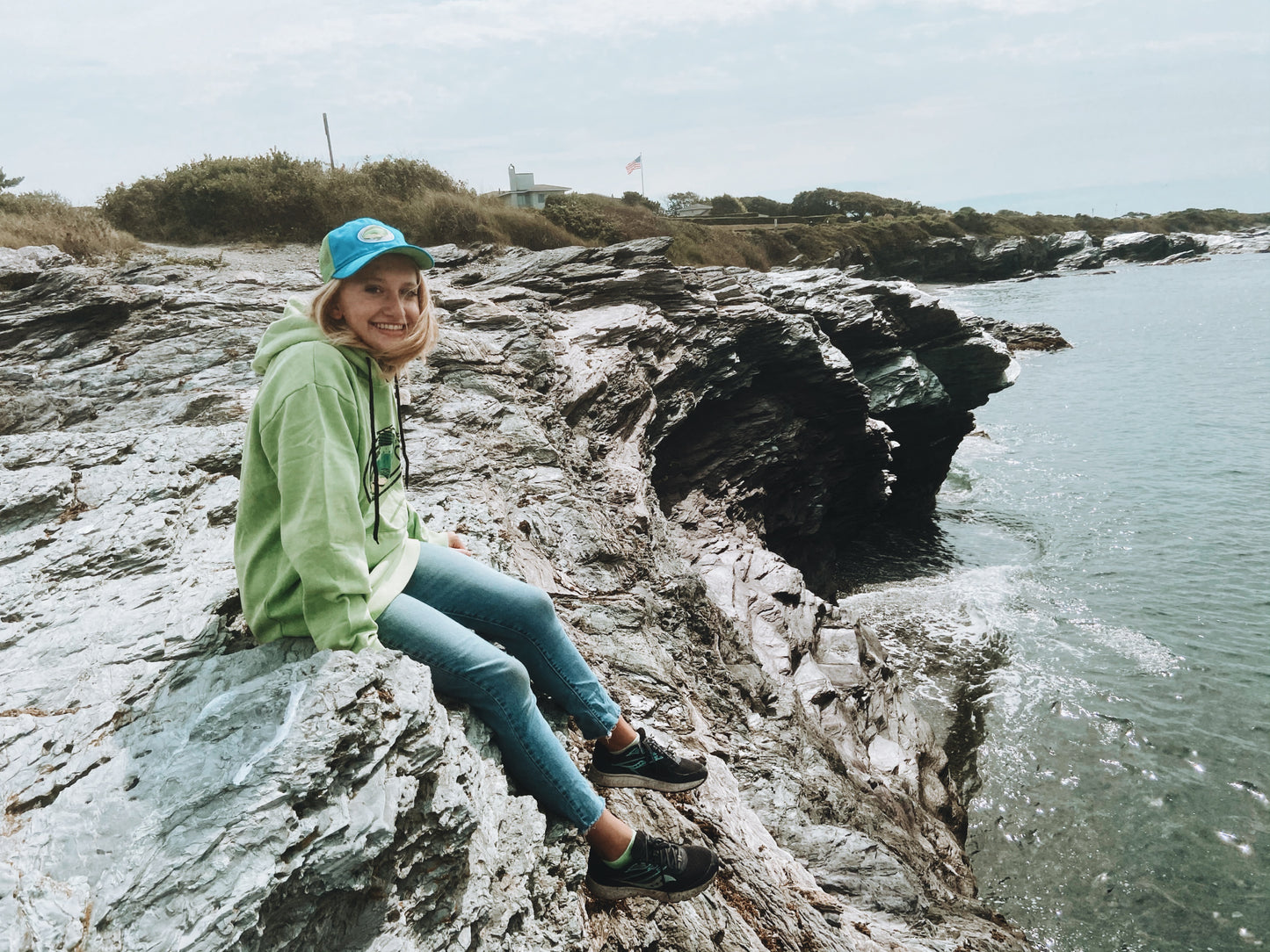 woman wearing washed lime green hoodie with vintage style mahi mahi graphic