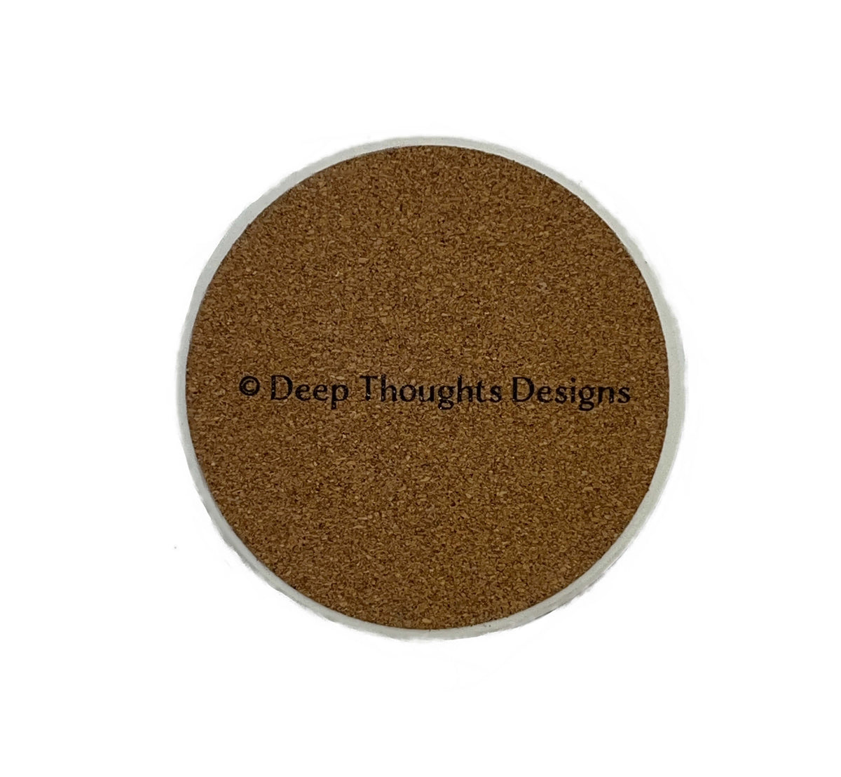 The cork backing of a circular ceramic Sandwich, MA drink coaster  with the text '© Deep Thoughts Designs' printed across the center, shown on a plain white background