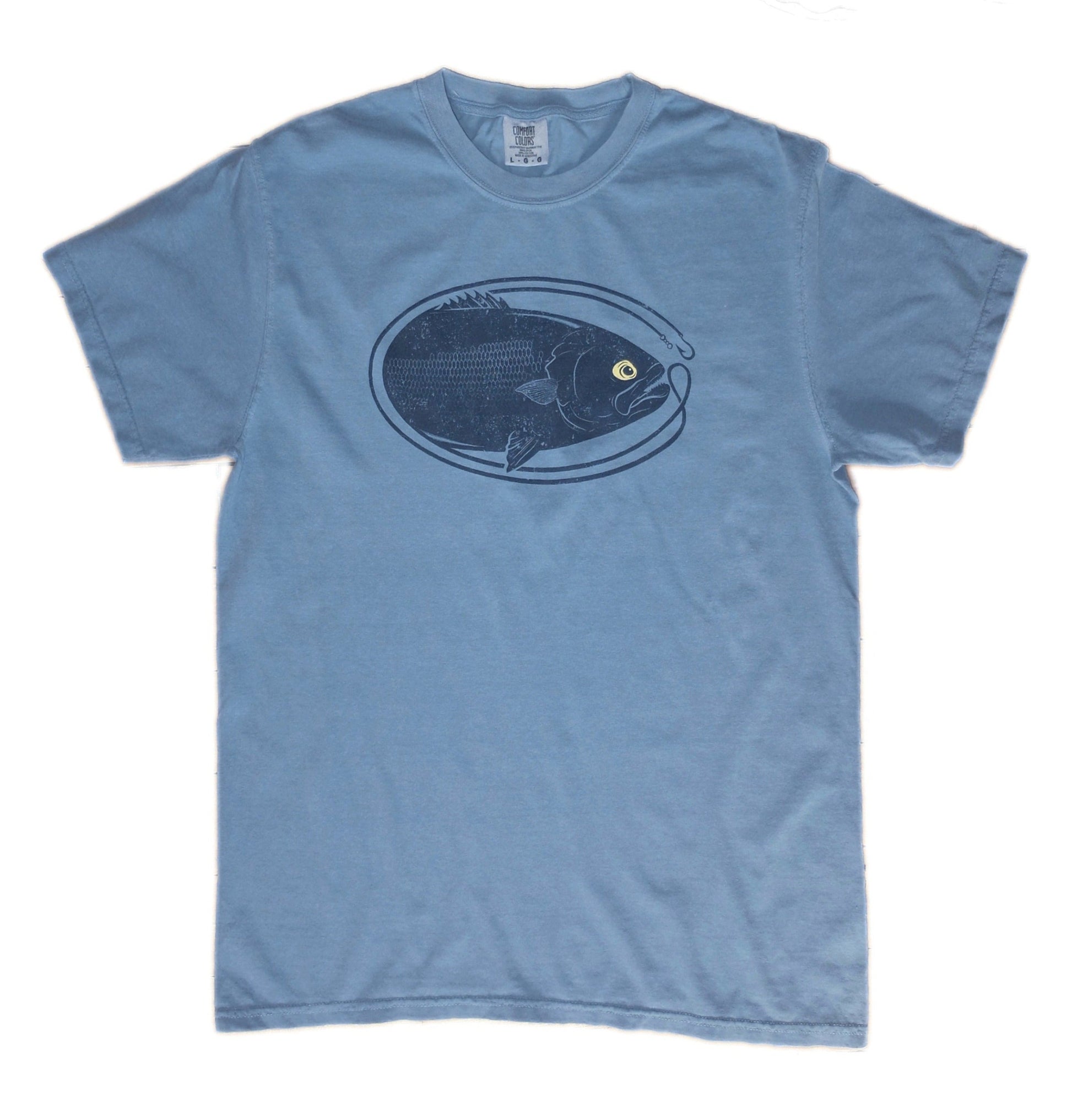 washed garment dye navy blue t-shirt with dark blue oval-shaped bluefish fishing graphic with yellow eyeball