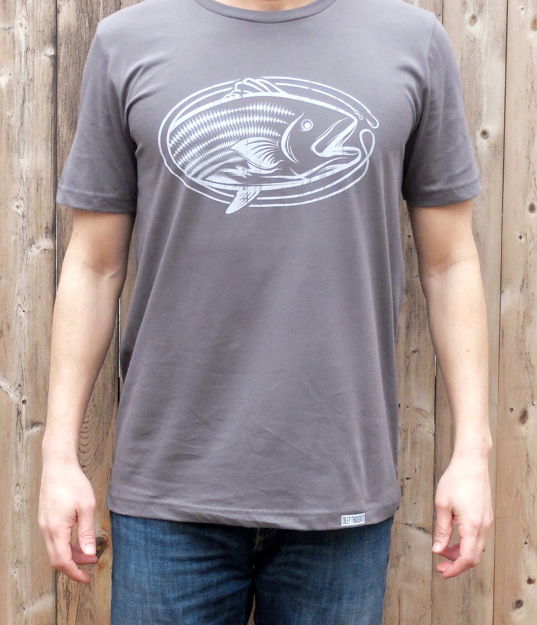 man wearing grey cotton t-shirt with white striped bass fishing graphic